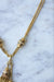 Necklace Negligee gold necklace and pompoms 58 Facettes