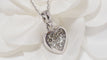 Collier Collier Cartier pendentif cœur, or blanc et diamants 58 Facettes 13807