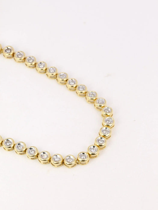 Bracelet Bracelet tennis vintage or jaune et diamants en serti clos 58 Facettes J92