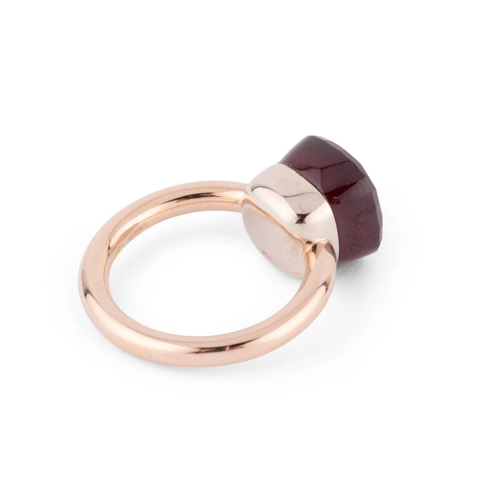 Bague  de la maison Pomellato modèle Nudo en grenat 58 Facettes 1