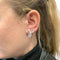 Boucles d'oreilles Boucles d'oreilles entrelacs en or blanc et diamants. 58 Facettes 31159