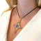 Pendentif Pendentif croix en or rose, citrines, tourmalines et tanzanite. 58 Facettes 31139
