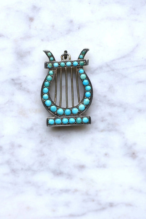 Pendentif Médaillon Lyre argent et turquoises 58 Facettes