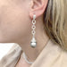 Earrings Dangling earrings in white gold, diamonds and pearls. 58 Facettes 33494