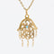 Pendentif Pendentif main de Fatma or perles et pierre turquoise 58 Facettes 18-008A