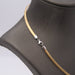 Collier Tour de cou rigide en or bicolore 18 carats 58 Facettes E358738A