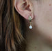 Earrings Yellow gold pearl dangling earrings 58 Facettes 19-456A