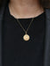 AUGIS pendant - Love medal in gold - More than yesterday, less than tomorrow 58 Facettes J249