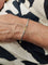 Bracelet BRACELET GRAIN DE CAFÉ OR ET ACIER 58 Facettes 071111