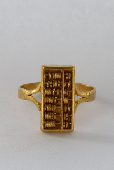 Bague 57.5 24k gold abacus ring 58 Facettes