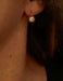 Gold Sleeper Earrings and White Stones 58 Facettes