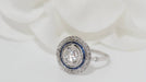 Ring Art Deco platinum double entourage ring, calibrated sapphires and diamonds 58 Facettes