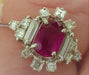 Ring 57 White gold ring, fine ruby ​​in the center and Princess diamond surround 58 Facettes