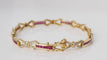 Bracelet Bracelet vintage en or jaune, rubis calibrés et diamants 58 Facettes 31672