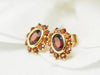 Earrings Yellow gold and garnet daisy earrings 58 Facettes 25806