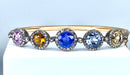 Bracelet Bangle bracelet in 18-carat gold, multi-stone: sapphire, topaz, citrine. Napoleon III period. 58 Facettes AB272
