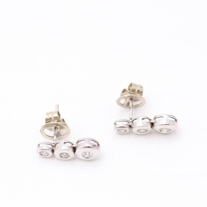 Boucles d'oreilles boucles d'oreilles triples en or blanc et diamants 58 Facettes E360508