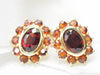 Earrings Yellow gold and garnet daisy earrings 58 Facettes 25806
