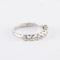 Bague Demi alliance en or gris sertie clos, diamants 58 Facettes 750