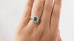 Bague Bague entourage en or blanc, émeraude et diamants 58 Facettes 31491