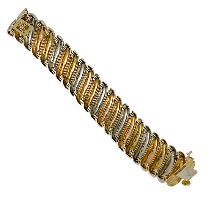 Bracelet Poiray en trois tons d'or.