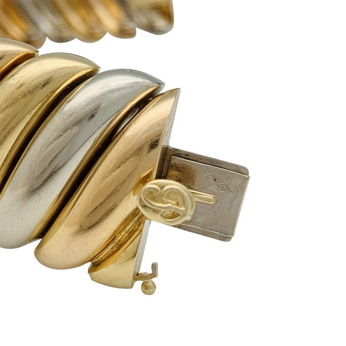 Poiray bracelet in three tones of gold.
