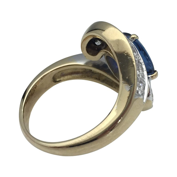 Tourbillon ring in yellow and white gold, sapphires and diamonds.