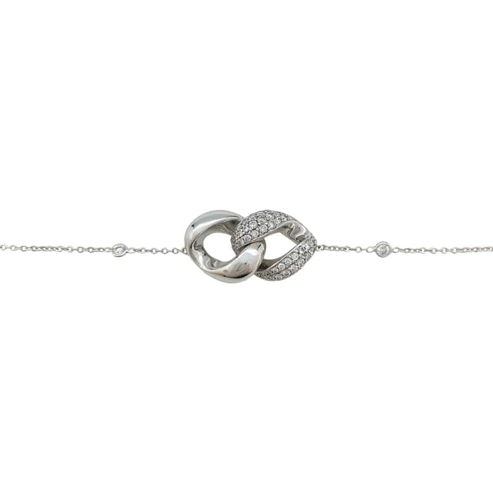 Bracelet Messika "Infinity" en or blanc et diamants.