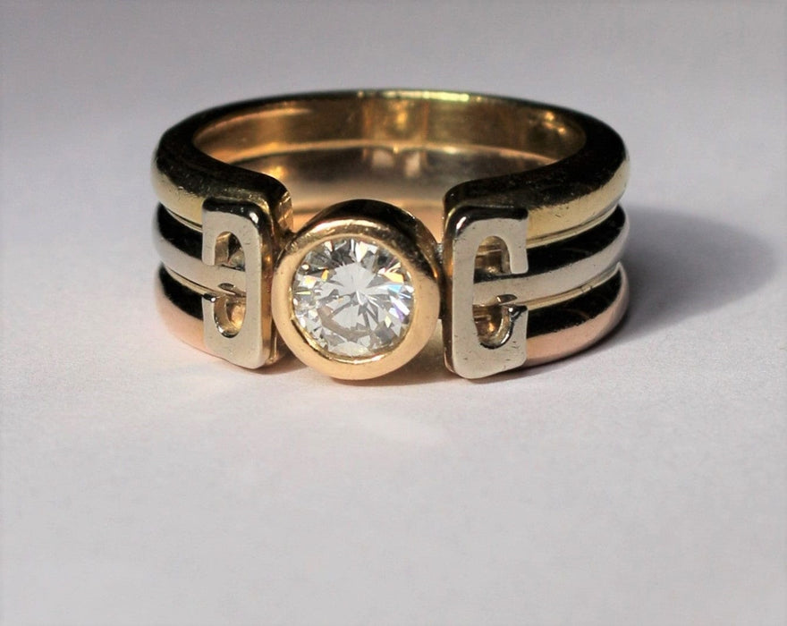Three Gold ring set with a diamond