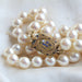 Necklace Baroque cultured pearl necklace and its old clasp 58 Facettes 01-124