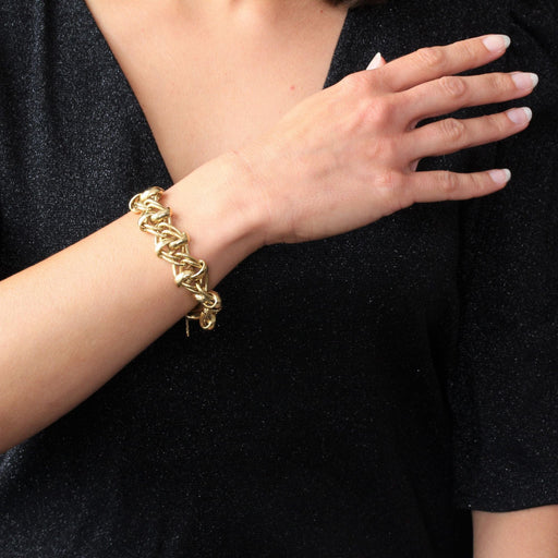 Bracelet Bracelet gourmette en or jaune aux motifs entrelacés 58 Facettes DV2109
