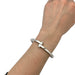 Cartier “Menottes” bracelet in white gold. 58 Facettes 30352